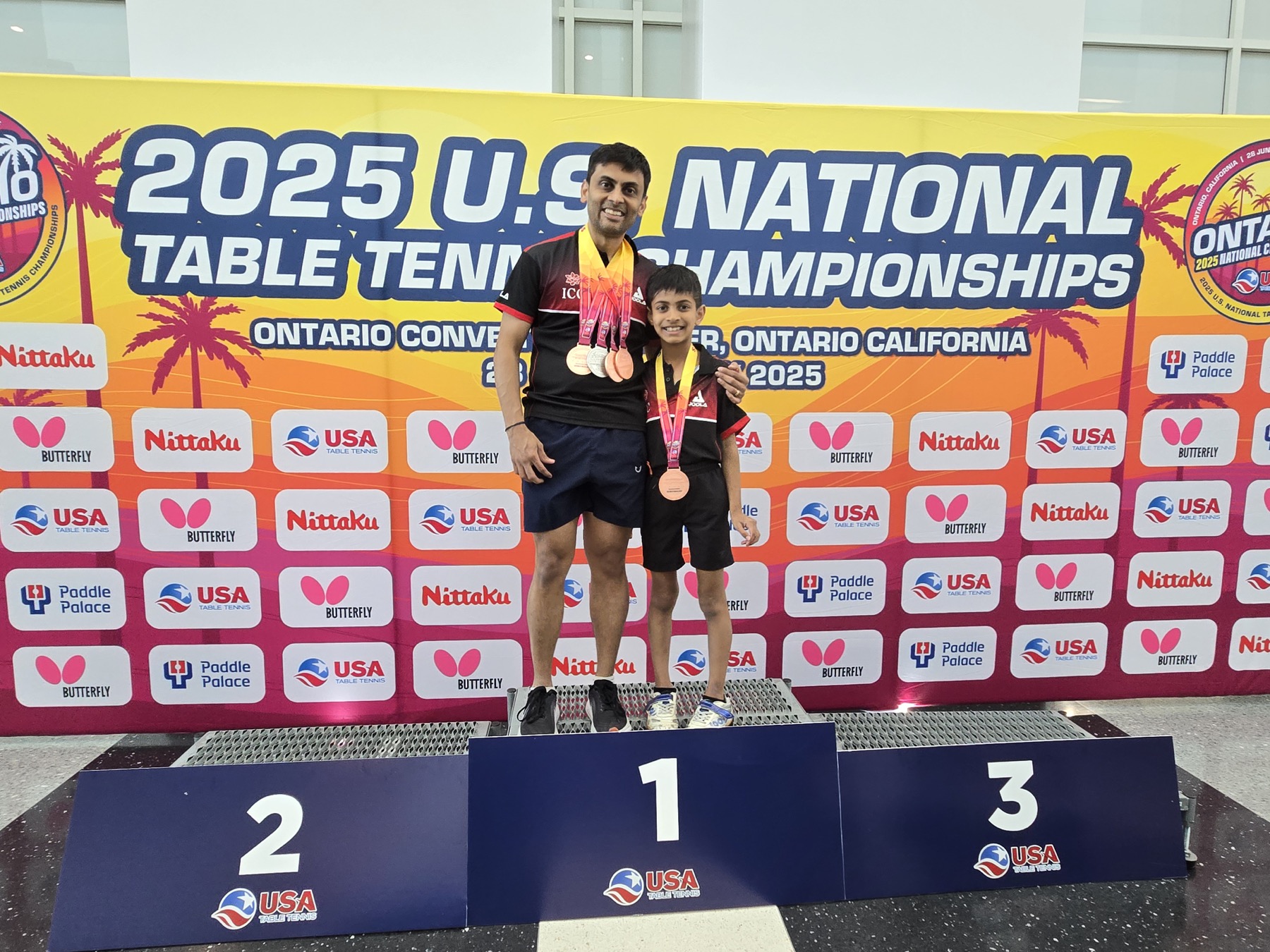 Srini and a young athlete at the 2025 US National Table Tennis Championships